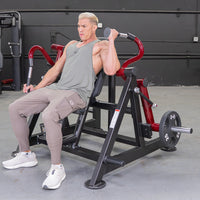 Thumbnail for Man using a red and black triceps extension machine with a 25lb weight plate.