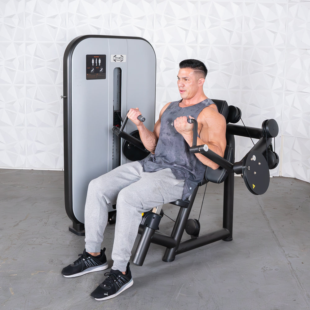Man using a gray and black biceps curl machine with pin selectorized weights.