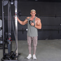 Thumbnail for Muscular man in a gym performing a chest fly exercise using a cable crossover machine.