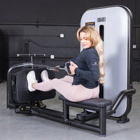 Thumbnail for Woman using a low row machine with a pin selectorized weight stack.