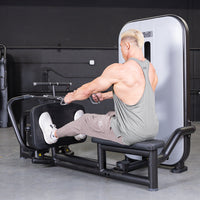 Thumbnail for Man performing a seated low row exercise on a gym machine.