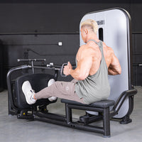 Thumbnail for Muscular man using a seated low row machine in a gym.