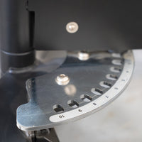 Thumbnail for Close-up of the adjustable seat's pin selectorized mechanism with numbered holes on a metal plate.