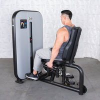 Thumbnail for Man using a grey and black inner/outer thigh workout machine with an adjustable seat.