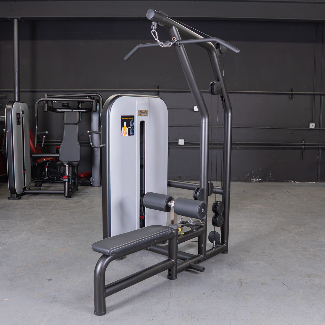 Black and gray lat pulldown and low row combo machine with an adjustable seat and pin-selectorized weight stack.