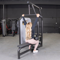Thumbnail for Woman with long blonde hair using a lat pulldown machine in a gym.