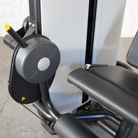 Thumbnail for Close-up of a leg extension machine with black padded seat and leg rest, gray weight stack, and adjustment knob.