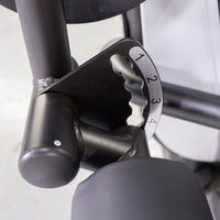 Thumbnail for Close-up of a black metal fitness machine adjustment mechanism with numbers 1-4.