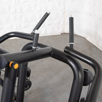 Thumbnail for Close-up of black metal frame and padded handles of a seated row machine.