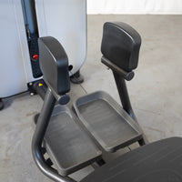 Thumbnail for Close-up of a standing abductor machine's foot platforms and leg pads.
