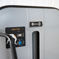 Thumbnail for Close-up of a Muscle D Fitness abductor machine with exercise instructions and brand logo.