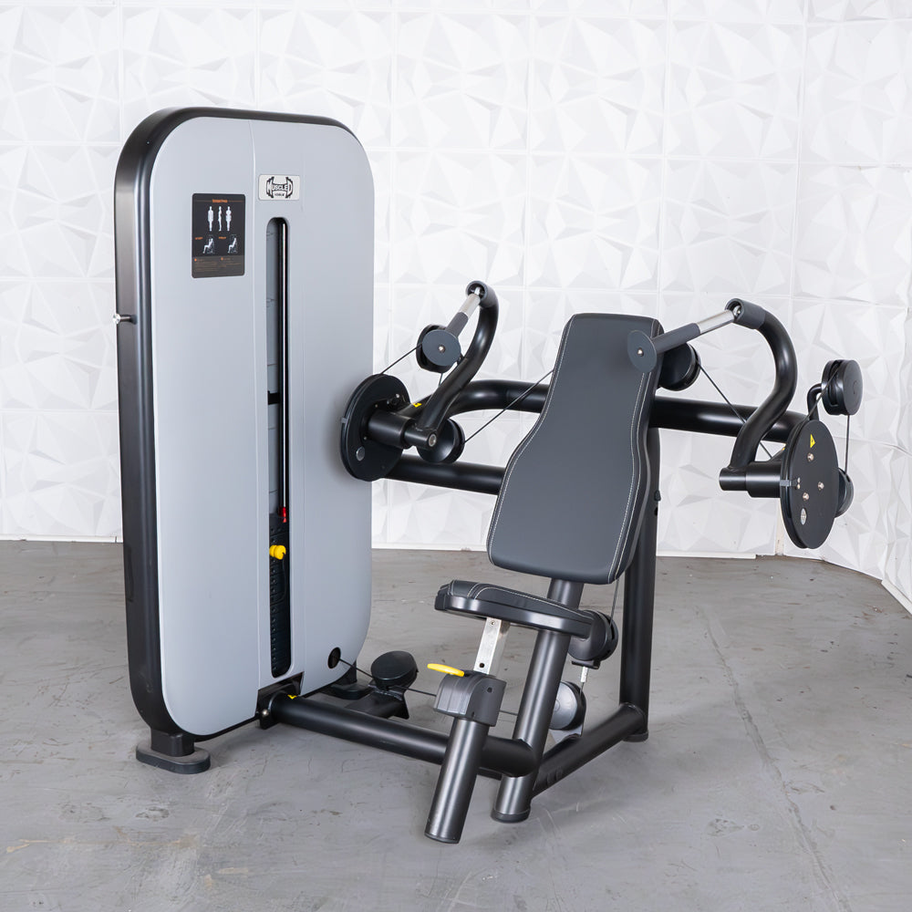 Gray and black triceps extension machine with adjustable seat and pin-selectorized weight stack.