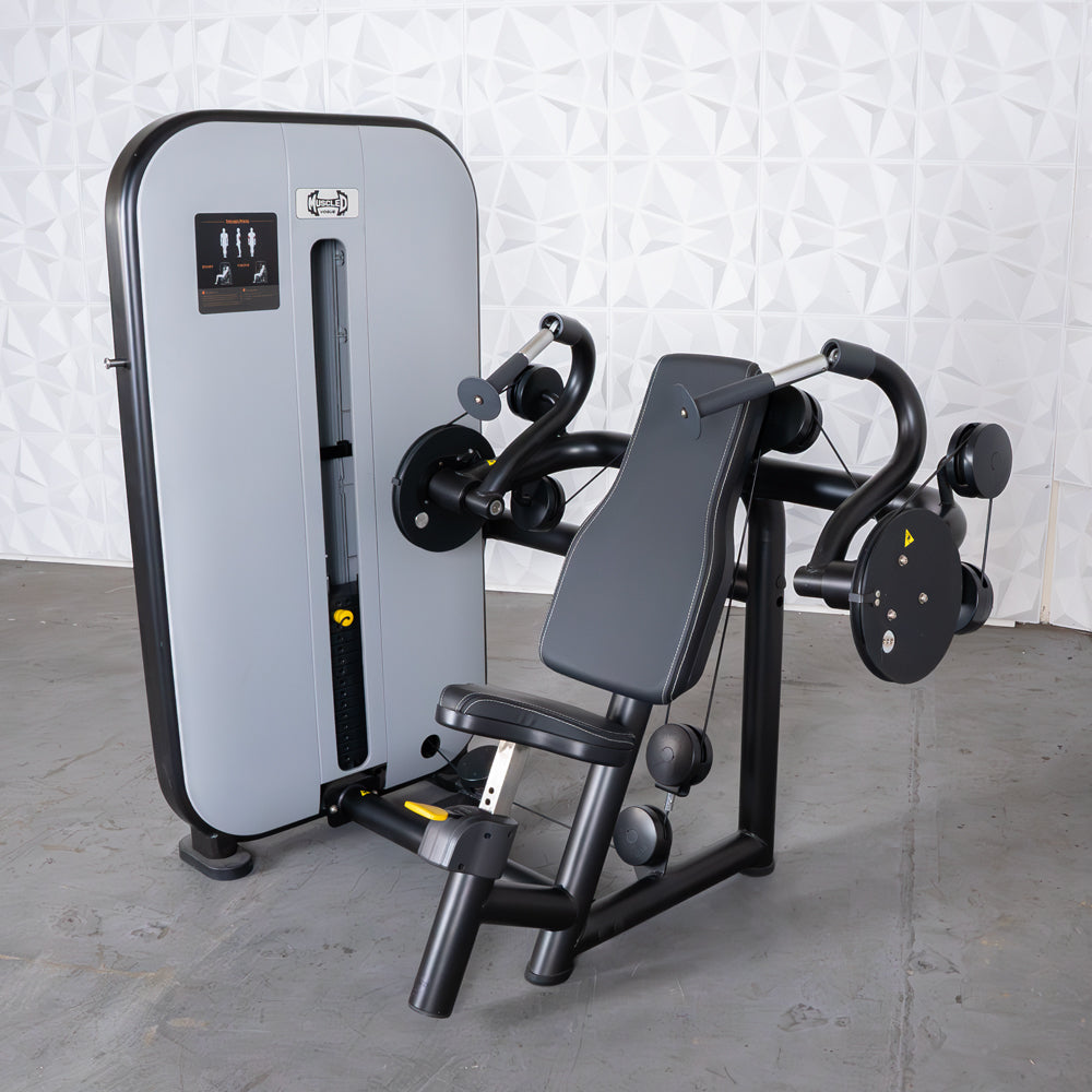 Gray and black triceps extension machine with adjustable seat and pin-selectorized weight stack.
