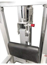 Thumbnail for Close-up of the adjustable knee pad and selectorized weight stack mechanism on a chin-dip assist machine.