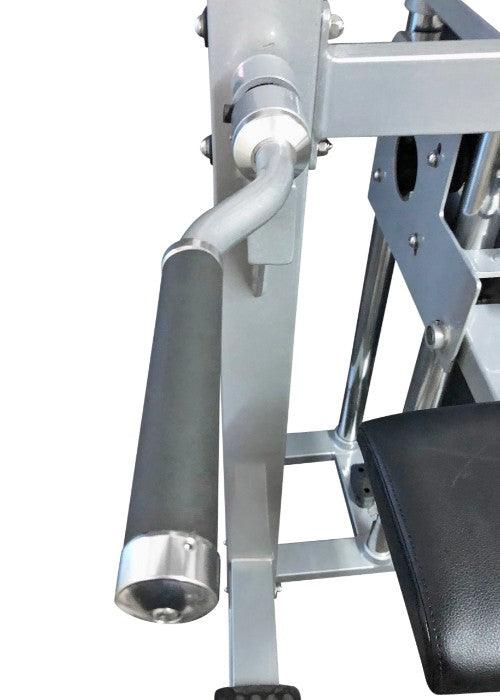 Close-up of a silver chin-dip assist machine with a black padded handle and seat.