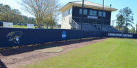 Thumbnail for Navy backstop padding with a Buccaneers logo running behind home plate