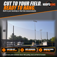 Thumbnail for Black backstop netting hung on tall poles curving behind a home-plate wall printed Baseball on a turf field