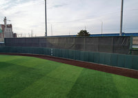 Thumbnail for FenceMate baseball batter's eye screen with green outfield wall padding installed at University of Pennsylvania baseball field