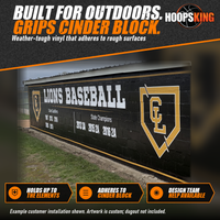 Thumbnail for Close view of a black dugout vinyl wrap with white Lions Baseball lettering and state qualifier years on a cinder block wall