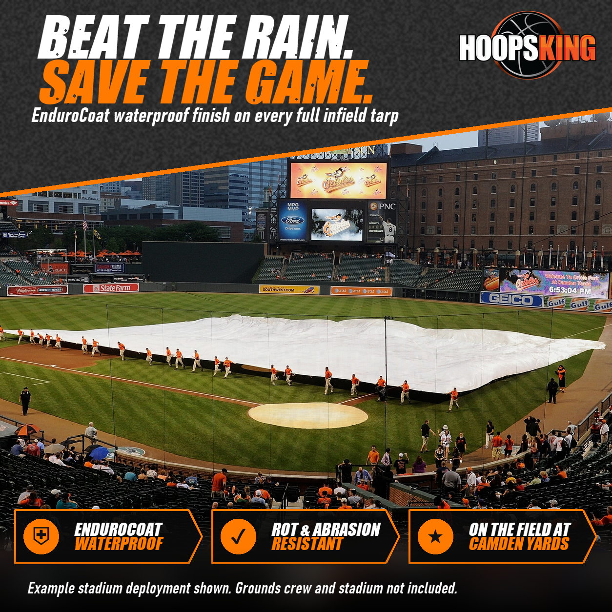 Grounds crew in orange pulling a white FieldSaver full infield rain tarp across the diamond at Camden Yards in Baltimore