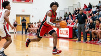 Thumbnail for Basketball player in a red Blazers uniform dribbling in a custom arm sleeve