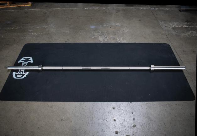 Stainless steel barbell on a black mat with a white logo.