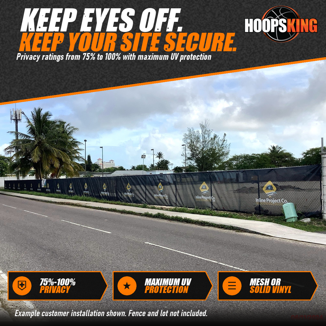 Long black privacy screen printed with repeating Inline Project Co. logos along a construction site fence beside a road