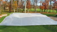 Thumbnail for FieldSaver golf course green cover from CoverSports protecting a putting green in late fall, with fall foliage and fairway visible in the background