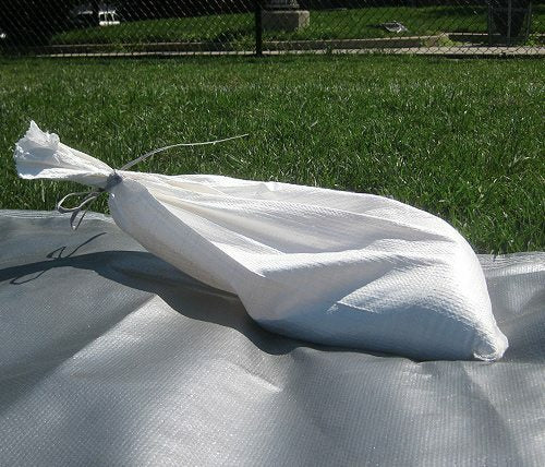 Sandbag secures FieldSaver field tarp