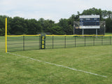 Black outfield fence with a yellow top rail, yellow foul pole and green 200 marker by a Unionville High School scoreboard