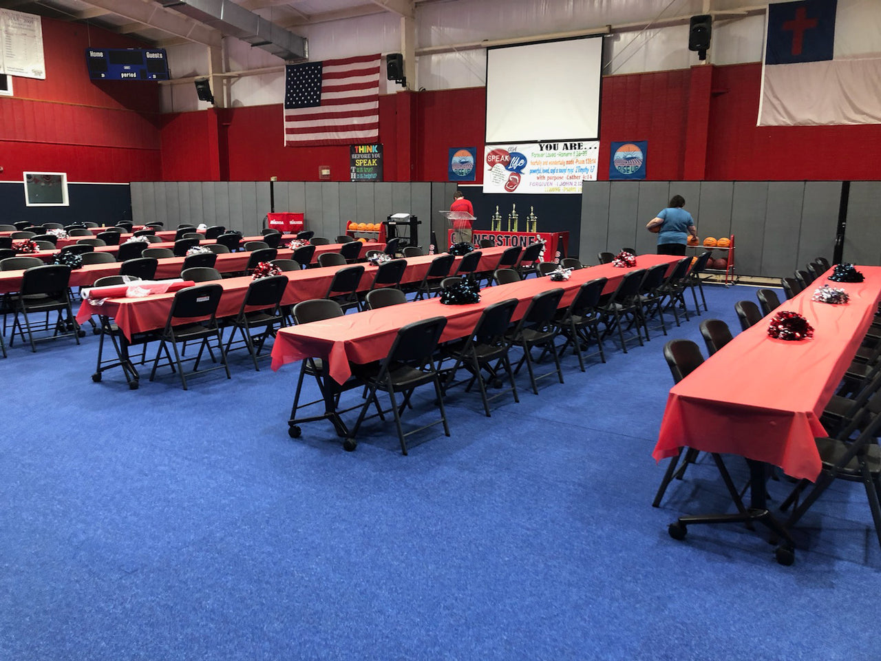 Blue carpet tiles dress up and protect gymnasium for banquest