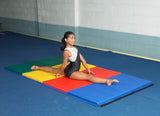 Gymnast on tumbling folding gymnastics mat