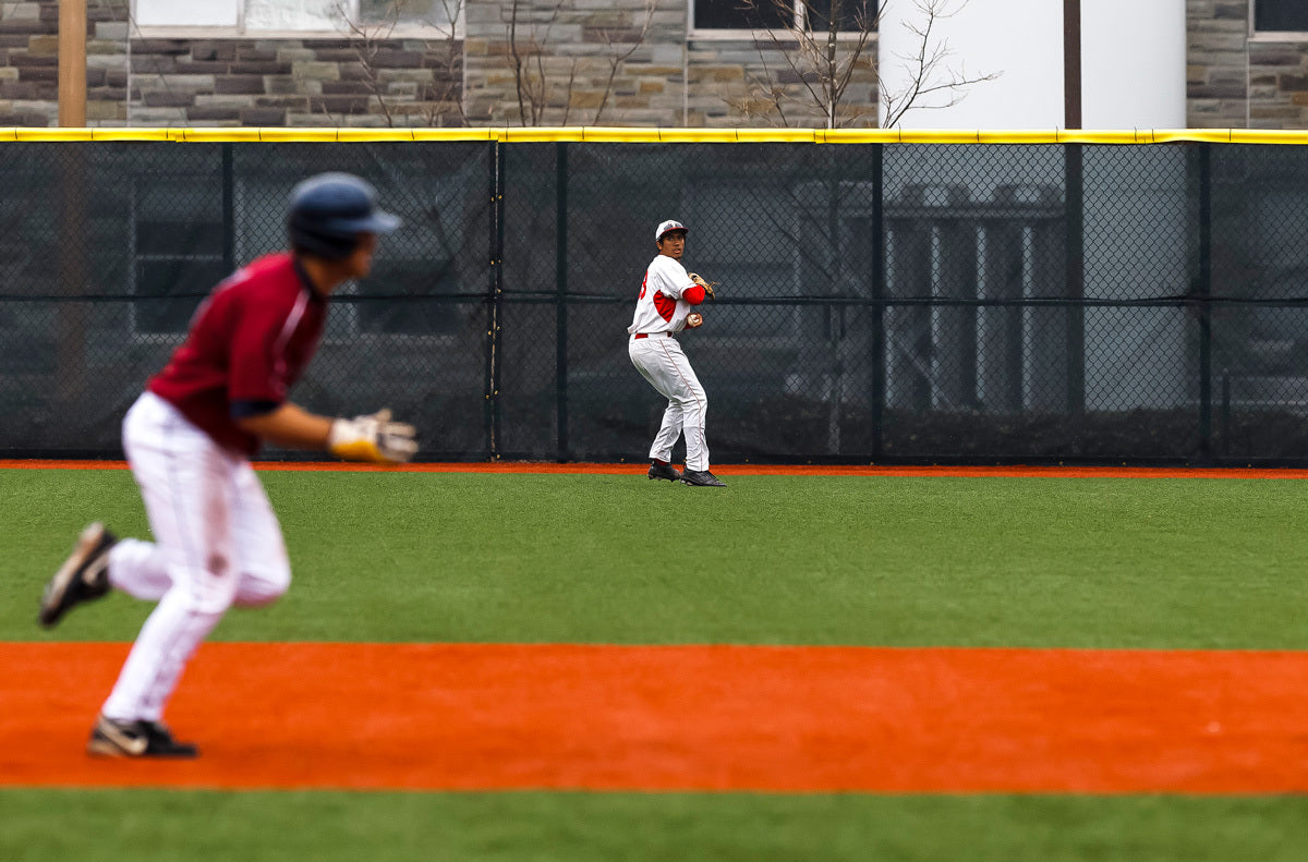 Outfielder makes play in front of windscreen