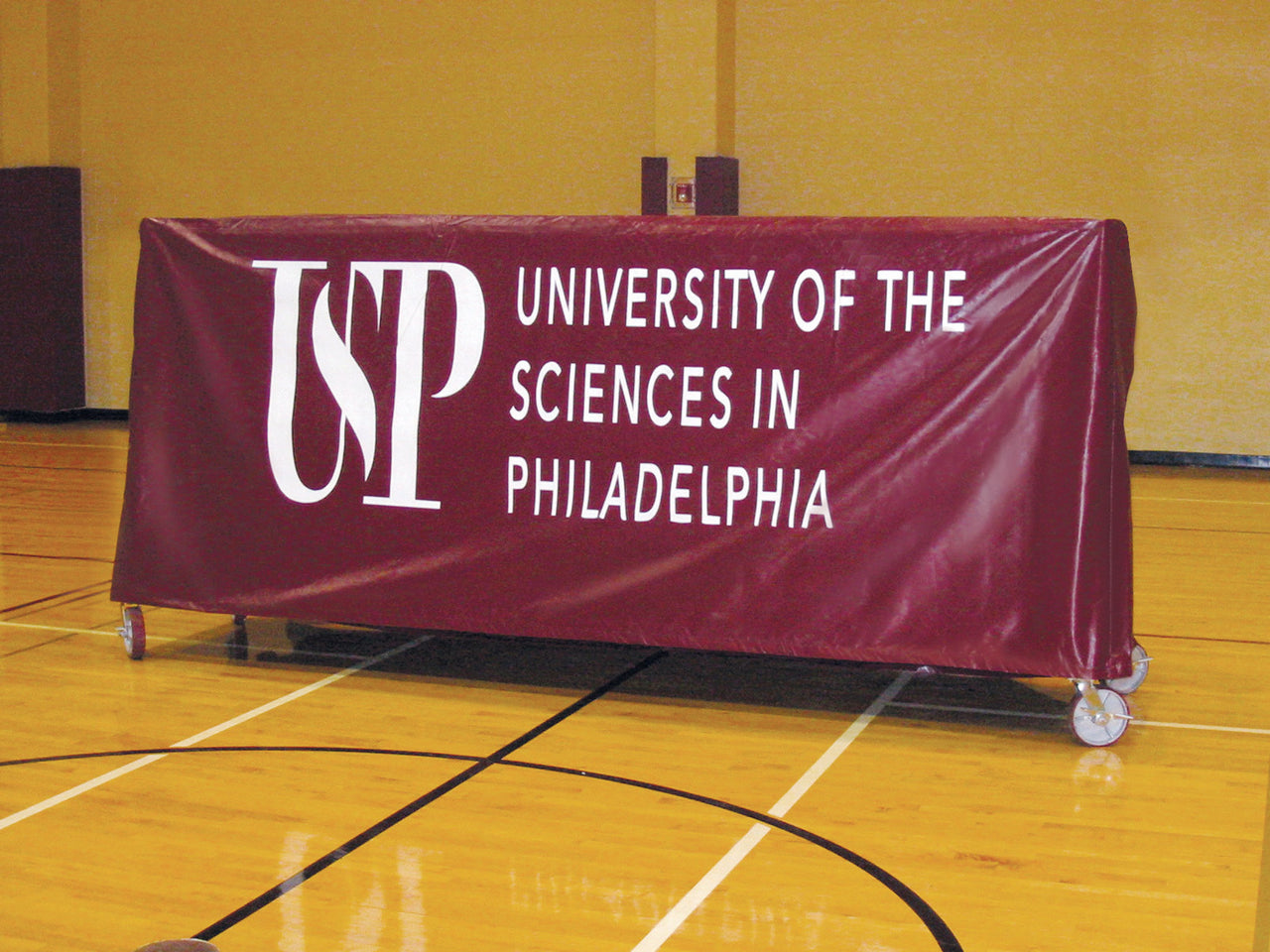 USP printed rack cover protects gym floor covers while not in use