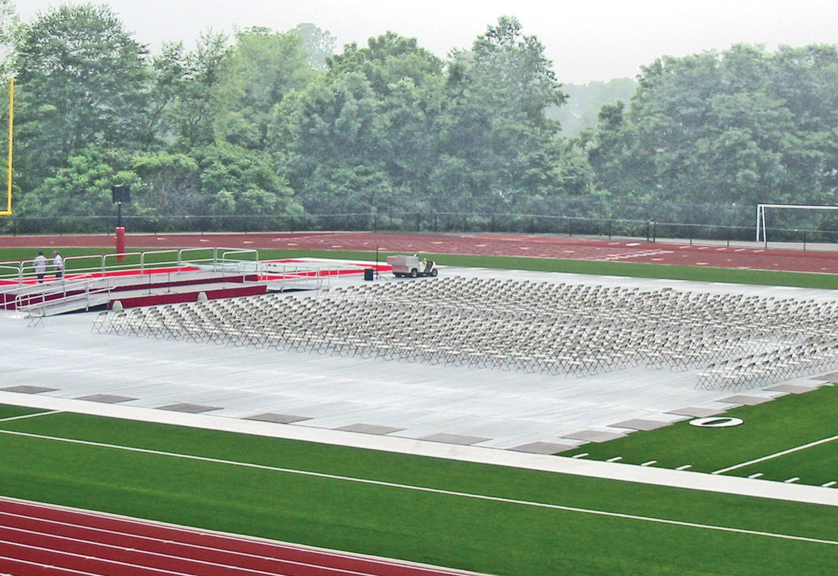 Turf protector field covers in use at graduation ceremony