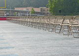 Stadium turf protector covers beneath chairs at graduation