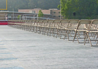 Thumbnail for Stadium turf protector covers beneath chairs at graduation