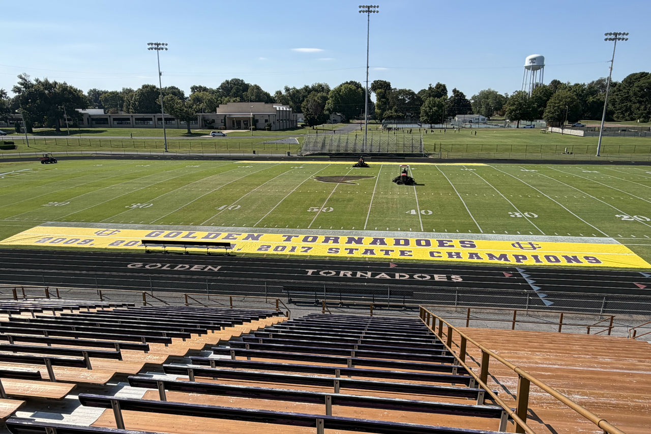 Custom sideline tarps for football featuring Golden Tornadoes branding on ArmorMesh material with custom printing