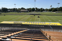 Thumbnail for Custom sideline tarps for football featuring Golden Tornadoes branding on ArmorMesh material with custom printing