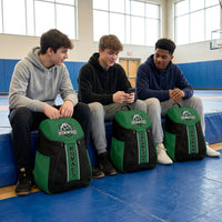 Thumbnail for High school wrestlers with black and green custom team backpacks on the mat