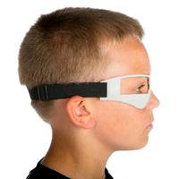 Thumbnail for Side view of the dribble goggles on a player: the open frame sits at eye level, the lower panel blocks the downward view, and the black elastic strap goes around the head