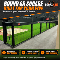 Thumbnail for Black square rail padding and post pads lining the frame of an indoor batting cage with green turf and netting