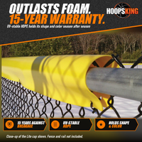 Thumbnail for Close-up of a yellow Safety Top Cap Lite fitted over a galvanized chain-link top rail with dappled shade