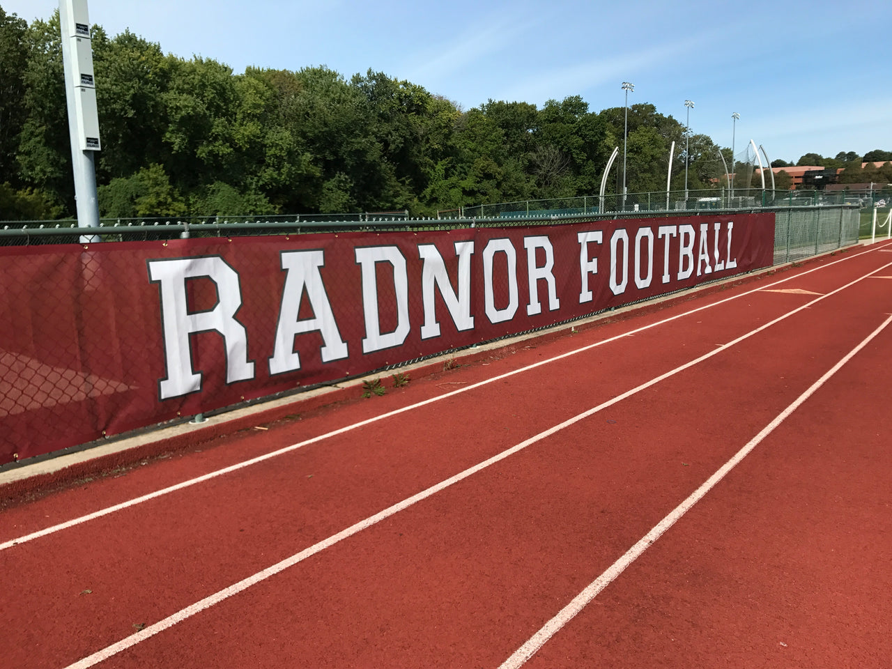Radnor Football windscreen along a track fence