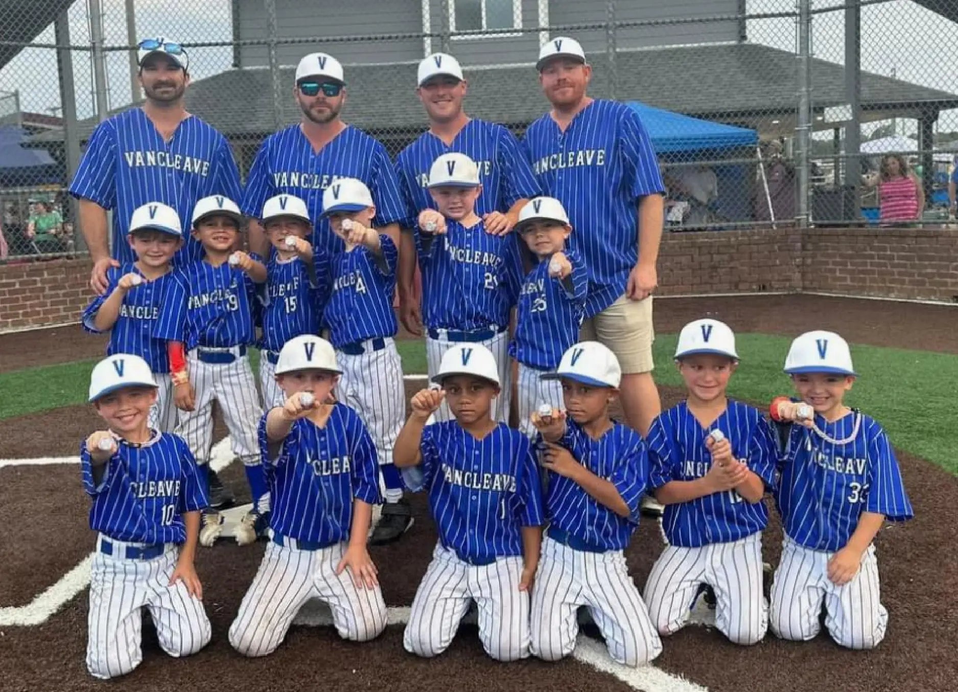 youth baseball team wearing fast custom jerseys