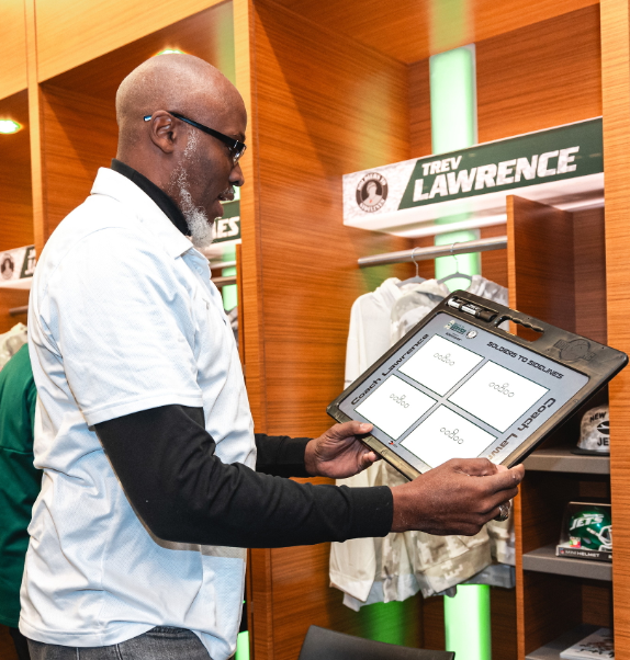 “Veteran football coaches at MetLife Stadium using HoopsKing Pro Custom Football Coaching Boards during the New York Jets Soldiers to Sidelines Coaching Clinic.”