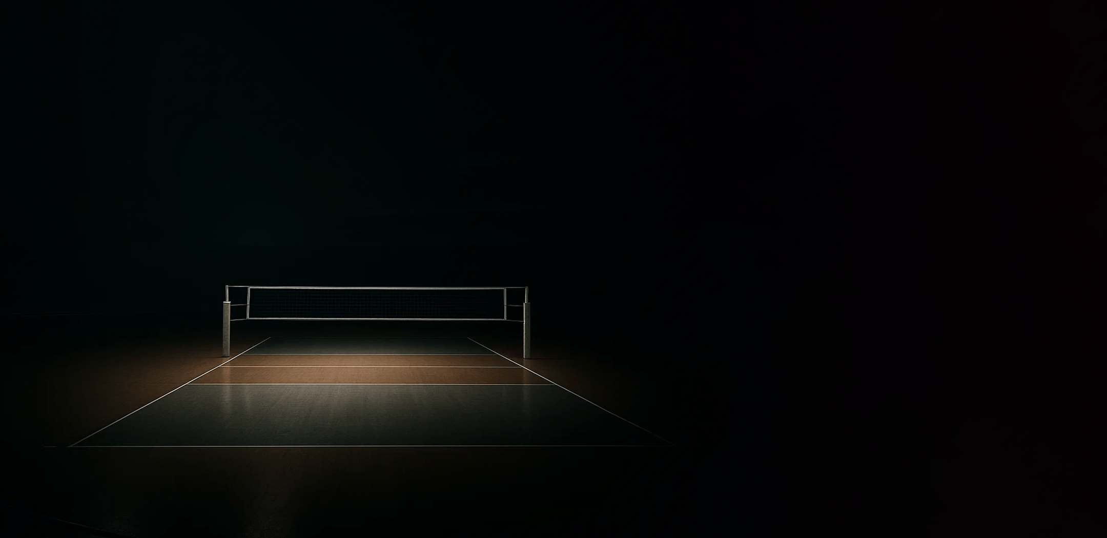 An atmospheric image of a person standing alone on a spotlighted basketball court in a dark arena. The text overlay reads, 