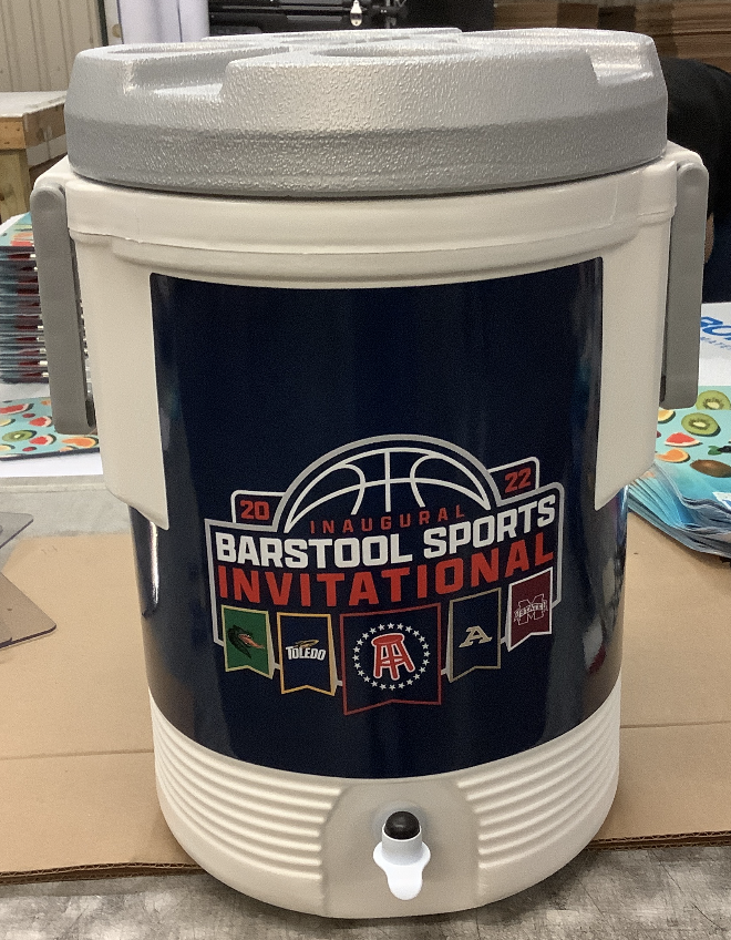 Customized 5-gallon cooler with pressure-fit lid and custom graphic wrap for team branding.