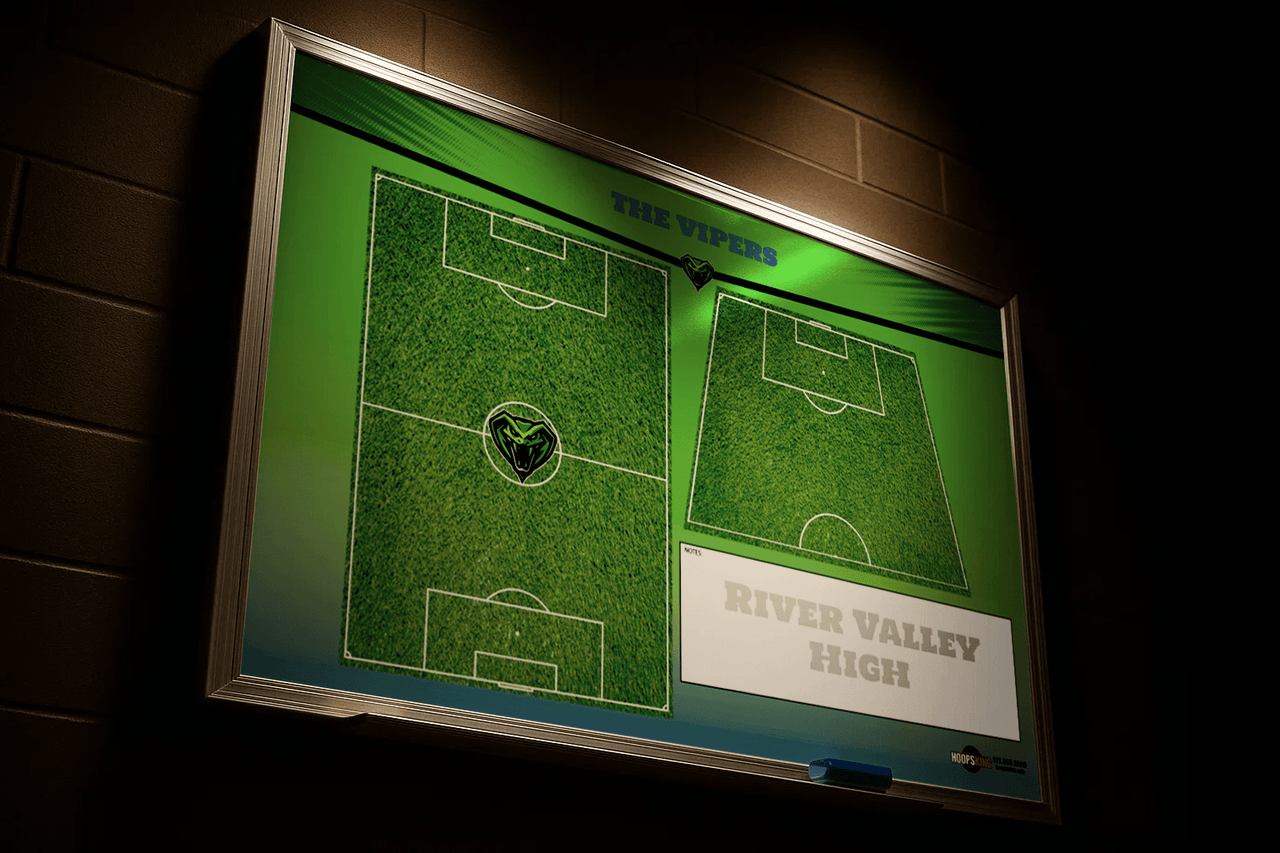 Custom soccer whiteboard with green field graphics and "River Valley High" text, mounted on a dark brick wall.