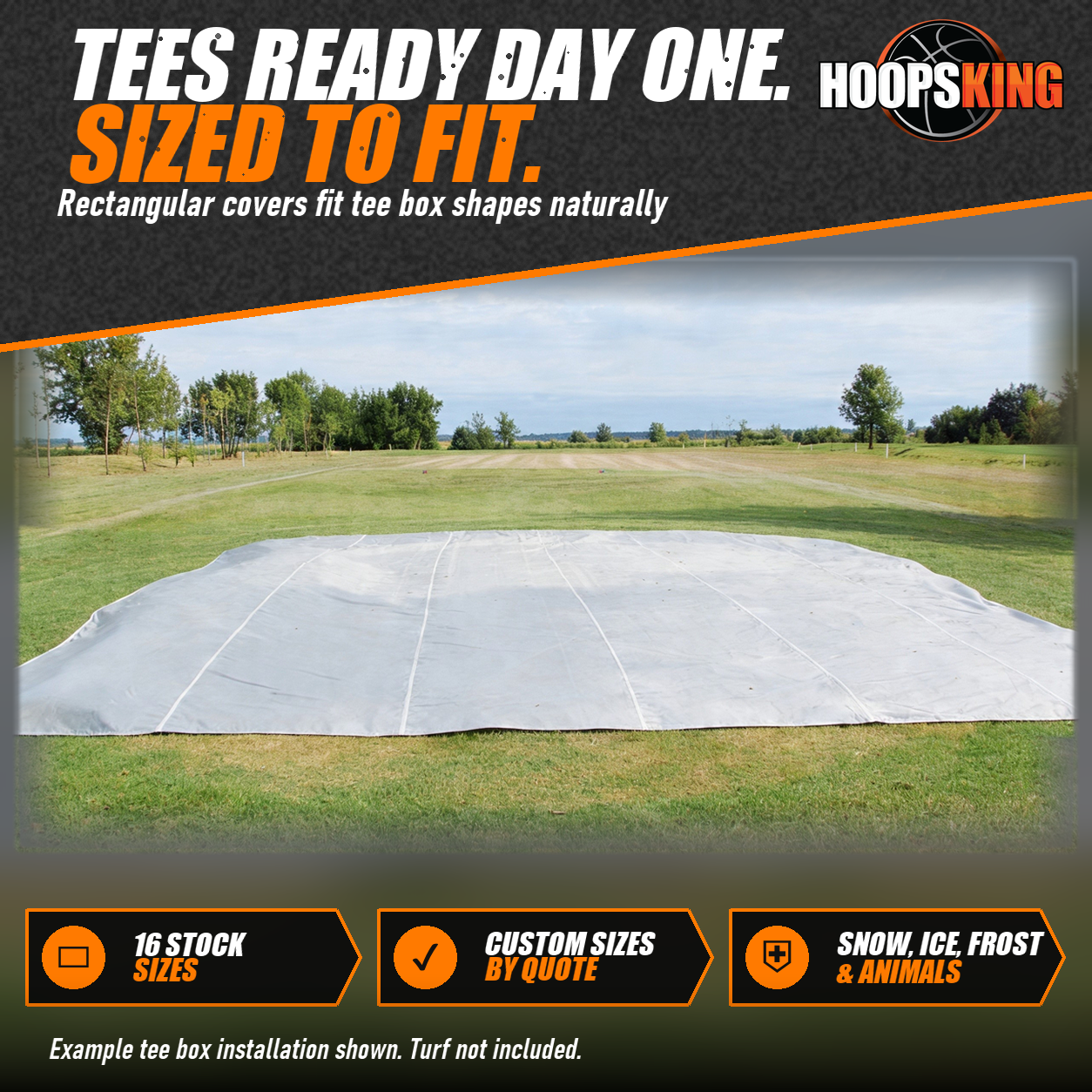 Rectangular white FieldSaver cover laid flat over a tee box on an open golf course